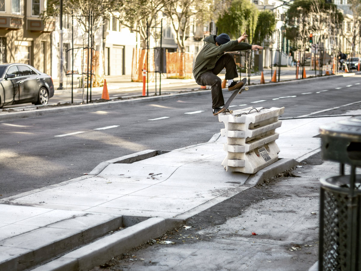 Cody Rosenthal frontside nosegrinds a barrier in San Francisco.